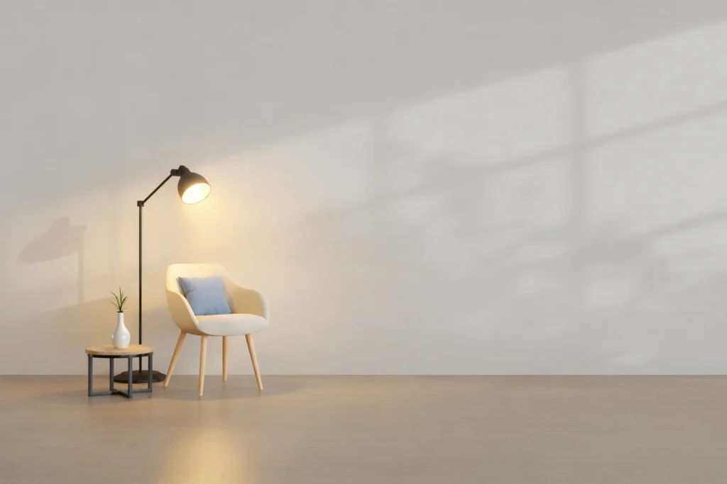 Minimalist interior with armchair and floor lamp creating soft ambient lighting